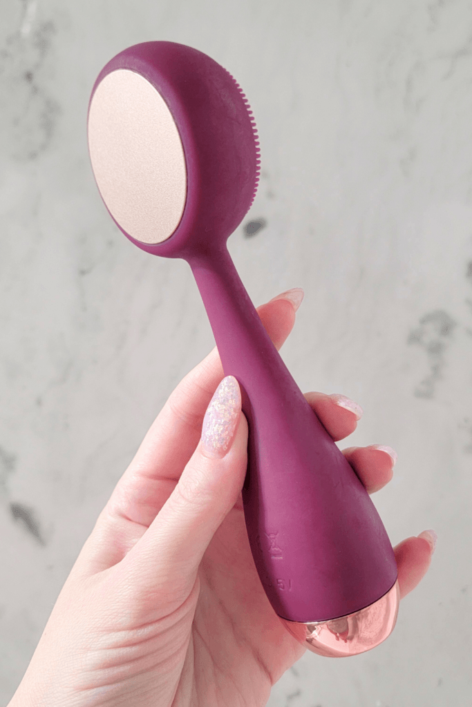 PMD Clean Pro facial cleansing brush with a warming massage plate