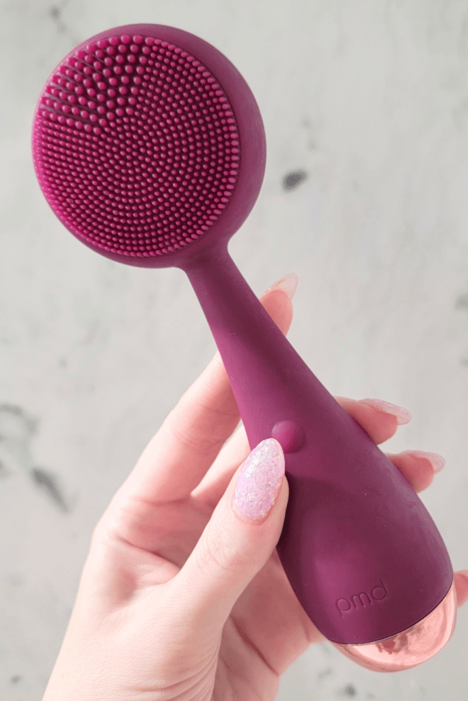 A silicone facial cleansing brush with soft bristles