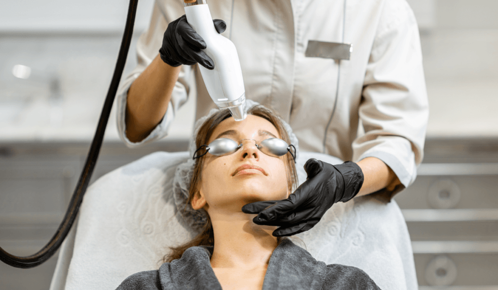 Woman receiving a laser treatment on her face